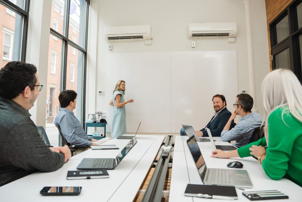 The Salvo founding team collaborating around a whiteboard in a bright office